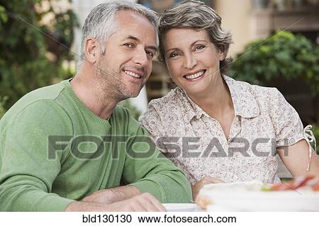 Couple smiling together outdoors View Large Photo Image Stock Image - Couple smiling together outdoors. Fotosearch