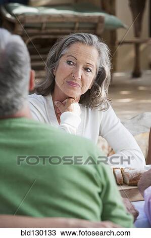 Couple talking outdoors View Large Photo Image Stock Image - Couple talking outdoors. Fotosearch