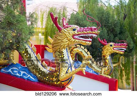 Stock Photograph - Dragon statues outside Dhammikarama Burmese temple, George Town, Penang, Malaysia. Fotosearch