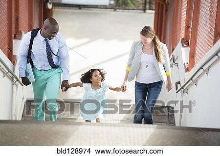 Picture - Family walking up stairs. Fotosearch