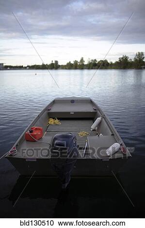 Fishing boat on calm river View Large Photo Image Stock Image - Fishing boat on calm river. Fotosearch