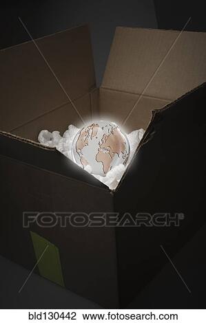 Glowing globe in delivery box View Large Photo Image Stock Image - Glowing globe in delivery box. Fotosearch