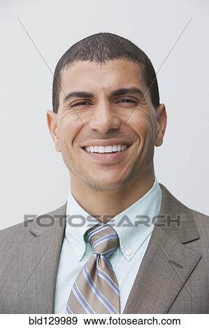 Stock Photo - Hispanic businessman smiling. Fotosearch