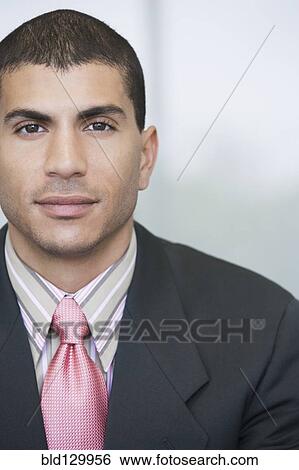 Stock Photograph - Hispanic businessman smiling. Fotosearch