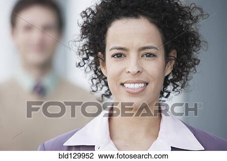 Stock Image - Hispanic businesswoman smiling. Fotosearch
