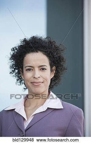 Stock Photo - Hispanic businesswoman smiling. Fotosearch