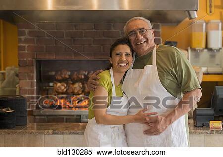 Hispanic father and daughter working in restaurant View Large Photo Image Stock Photography - Hispanic father and daughter working in restaurant. Fotosearch