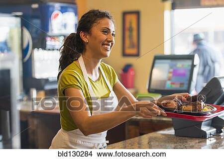 Hispanic server working in cafe View Large Photo Image Picture - Hispanic server working in cafe. Fotosearch