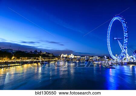 Stock Image - London Eye overlooking river front, London, United Kingdom. Fotosearch