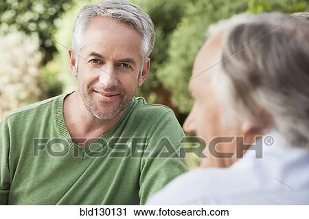 Man smiling outdoors View Large Photo Image Stock Image - Man smiling outdoors. Fotosearch