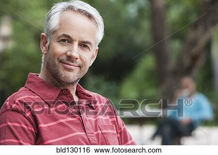 Man smiling outdoors View Large Photo Image Stock Photograph - Man smiling outdoors. Fotosearch