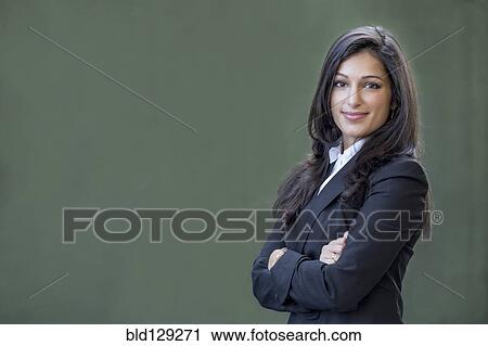 Mixed race businesswoman smiling View Large Photo Image Stock Image - Mixed race businesswoman smiling. Fotosearch