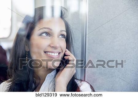 Mixed race businesswoman talking on cell phone View Large Photo Image Stock Photo - Mixed race businesswoman talking on cell phone. Fotosearch