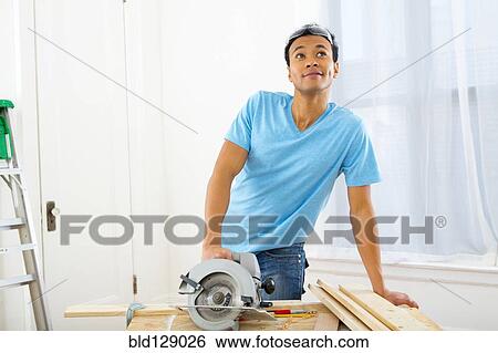 Mixed race carpenter thinking View Large Photo Image Stock Photograph - Mixed race carpenter thinking. Fotosearch