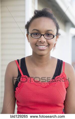 Stock Photography - Mixed race girl smiling outdoors. Fotosearch