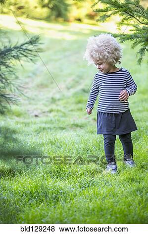 Mixed race girl walking outdoors View Large Photo Image Stock Photo - Mixed race girl walking outdoors. Fotosearch