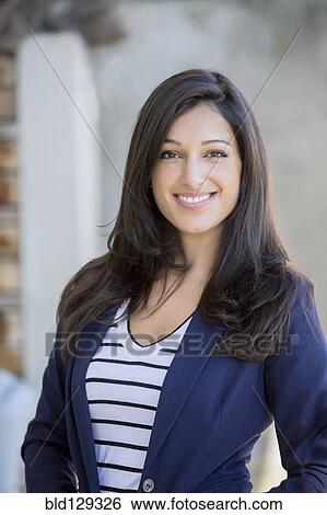 Mixed race woman smiling outdoors View Large Photo Image Stock Photograph - Mixed race woman smiling outdoors. Fotosearch