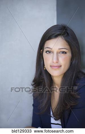 Stock Image - Mixed race woman smiling. Fotosearch