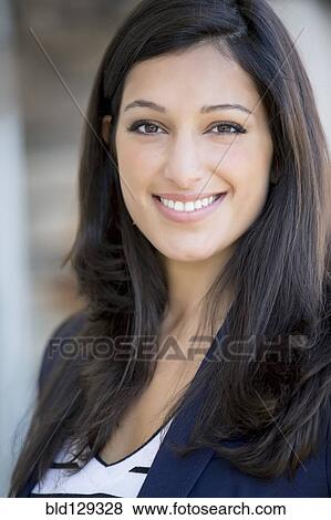 Stock Photo - Mixed race woman smiling. Fotosearch