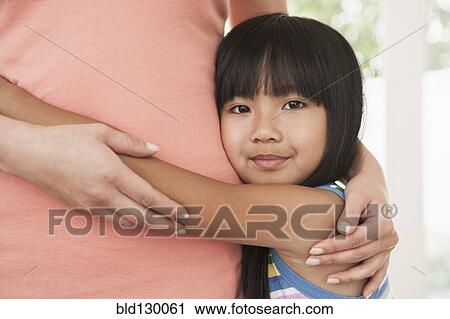 Mother and daughter hugging View Large Photo Image Stock Image - Mother and daughter hugging. Fotosearch