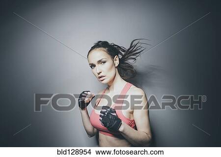 Picture - Portrait of Caucasian woman in fighting stance. Fotosearch