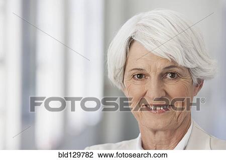 Stock Image - Senior Caucasian businesswoman smiling. Fotosearch