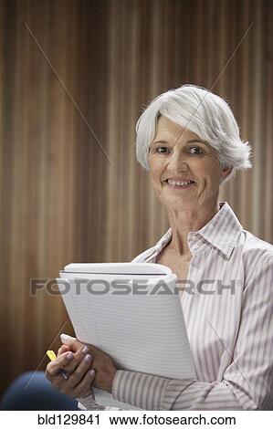 Stock Image - Senior Caucasian businesswoman smiling. Fotosearch