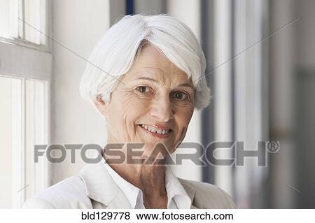 Stock Photo - Senior Caucasian businesswoman smiling in office. Fotosearch