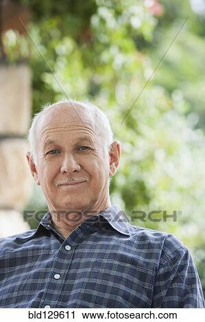 Stock Image - Senior Caucasian man outdoors. Fotosearch