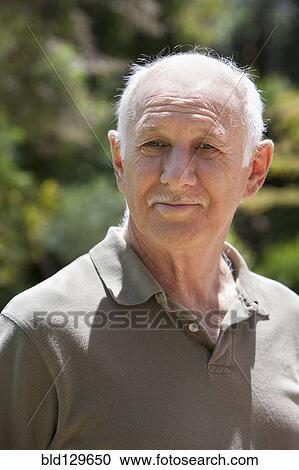 Stock Image - Senior Caucasian man smiling outdoors. Fotosearch