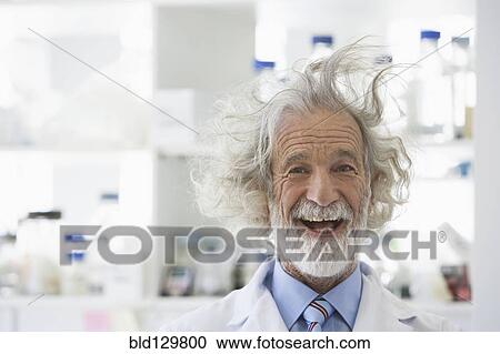 Stock Image - Senior Caucasian scientist with unruly hair in lab. Fotosearch