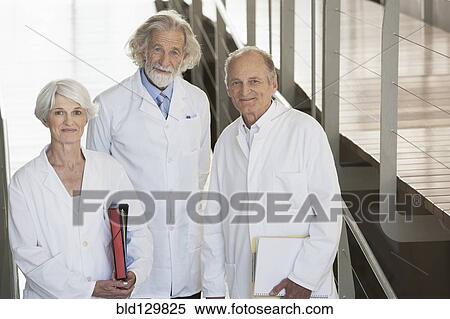 Senior Caucasian scientists smiling in office View Large Photo Image Stock Photography - Senior Caucasian scientists smiling in office. Fotosearch