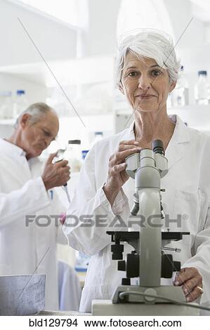 Senior Caucasian scientists working in lab View Large Photo Image Picture - Senior Caucasian scientists working in lab. Fotosearch