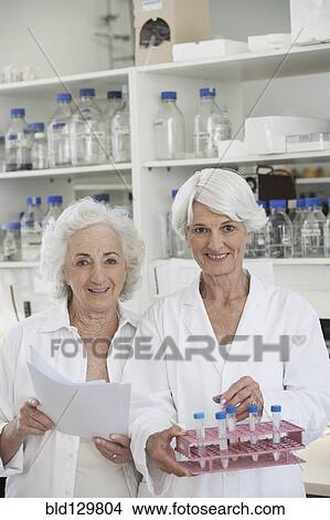 Senior Caucasian scientists working in lab View Large Photo Image Picture - Senior Caucasian scientists working in lab. Fotosearch