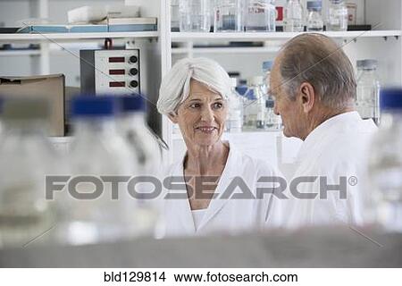 Picture - Senior Caucasian scientists working in lab. Fotosearch