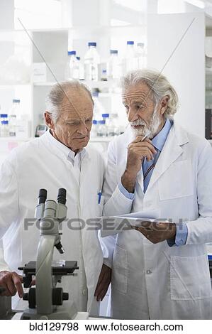 Senior Caucasian scientists working in lab View Large Photo Image Stock Photo - Senior Caucasian scientists working in lab. Fotosearch