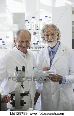 Senior Caucasian scientists working in lab View Large Photo Image Stock Photo - Senior Caucasian scientists working in lab. Fotosearch