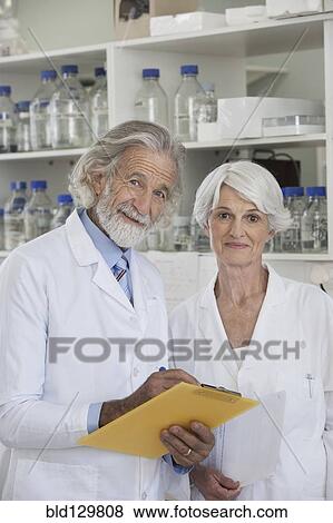 Senior Caucasian scientists working in lab View Large Photo Image Stock Photo - Senior Caucasian scientists working in lab. Fotosearch