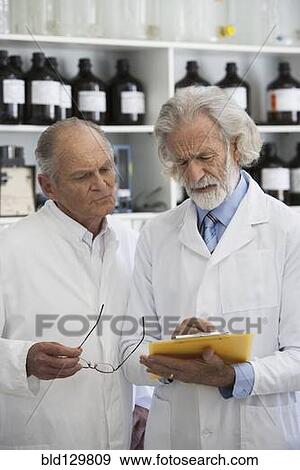 Stock Photo - Senior Caucasian scientists working in lab. Fotosearch