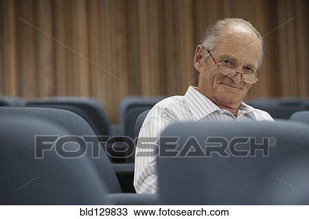 Senior Caucasian student sitting in classroom View Large Photo Image Stock Image - Senior Caucasian student sitting in classroom. Fotosearch