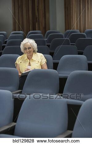 Stock Photo - Senior Caucasian student sitting in classroom. Fotosearch