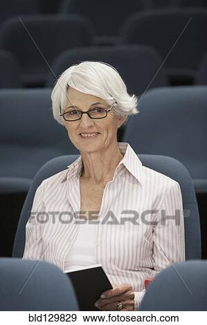Stock Photo - Senior Caucasian student sitting in classroom. Fotosearch