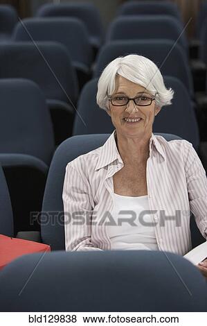 Stock Photo - Senior Caucasian student sitting in classroom. Fotosearch