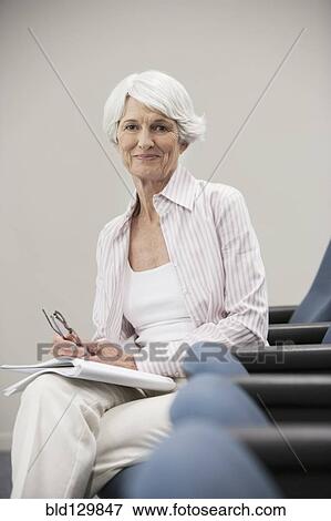 Senior Caucasian student sitting in classroom View Large Photo Image Stock Photo - Senior Caucasian student sitting in classroom. Fotosearch