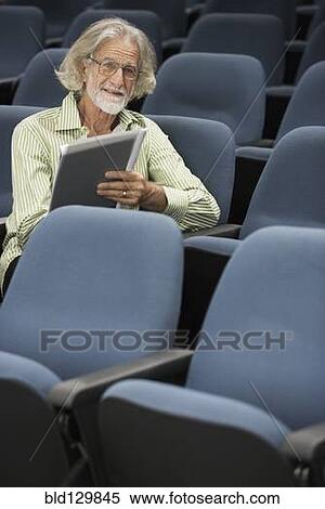 Stock Photography - Senior Caucasian student sitting in classroom. Fotosearch