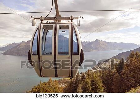 Ski lift overlooking mountain and lake View Large Photo Image Stock Photography - Ski lift overlooking mountain and lake. Fotosearch