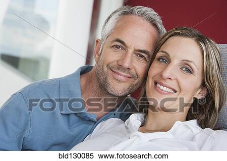 Stock Photography - Smiling couple hugging. Fotosearch