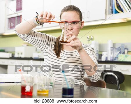 Stock Photo - Student working in chemistry lab. Fotosearch