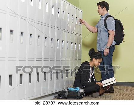 Students by lockers in school corridor View Large Photo Image Stock Photo - Students by lockers in school corridor. Fotosearch
