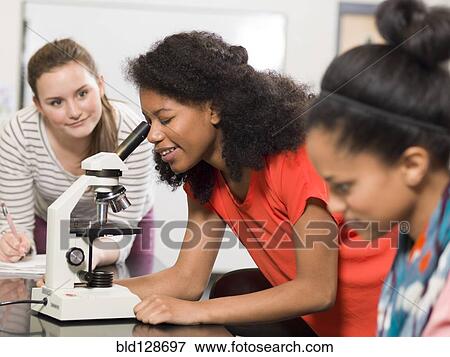 Students working together in chemistry lab View Large Photo Image Stock Photo - Students working together in chemistry lab. Fotosearch